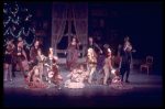 Christmas party scene with boys and their drums interrupting girls with dolls, in a New York City Ballet production of "The Nutcracker."