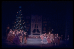 Party scene with parents and children dancing, in a New York City Ballet production of "The Nutcracker."