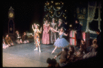 Shaun O'Brien as Drosselmeyer entertaining children with dancing dolls (incl. Nichol Hlinka as Columbine), in a New York City Ballet production of "The Nutcracker" (New York)