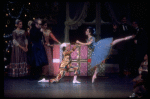 Shaun O'Brien as Drosselmeyer entertaining children with dancing dolls (incl. Nichol Hlinka as Columbine), in a New York City Ballet production of "The Nutcracker" (New York)