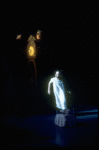 Shaun O'Brien as Drosselmeyer atop the grandfather clock directing the mice while Mary flees in fear, in a New York City Ballet production of "The Nutcracker" (New York)