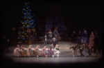 Act I party scene with Andre Kramarevsky as Drosselmeyer giving children stick horse and causing game of tug-of-war, in a New York City Ballet production of "The Nutcracker" (New York)
