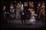 Act I party scene with Andre Kramarevsky as Drosselmeyer giving Mary a watch, in a New York City Ballet production of "The Nutcracker" (New York)