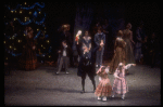 Act I party scene with Andre Kramarevsky as Drosselmeyer holding up the Nutcracker, in a New York City Ballet production of "The Nutcracker" (New York)