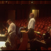 New York City Ballet production of "Tricolore"; Jerome Robbins watching as Robert Irving conducts, composer Georges Auric and conductor Hugo Fiorato sitting at right, choreography by George Balanchine (New York)