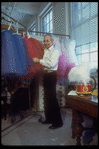 New York City Ballet production of "Tricolore" with designer Rouben Ter-Arutunian checking costumes at Karinska's shop (New York)