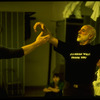 Choreographer Jerome Robbins, (R) wearing t-shirt reading "It's going well thank you," instructing dancer during rehearsal for show "Jerome Robbins' Broadway.