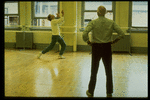 Choreographer Jerome Robbins (R) watching as dancer Robert La Fosse (L) rehearses "Mr. Monotony" number for "Jerome Robbins' Broadway".