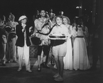 Producer Joseph Papp (2R, holding cake) with castmembers (L-R) Mary Elizabeth Mastrantonio, Jeff Goldblum and Michelle Pfeiffer onstage to celebrate Papp's 68th birthday after a Central park performance of "Twelfth Night"