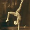 Dancer in handstand wearing rhinestone costume