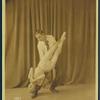 Female dancer being held upside down by male partner