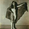 Dancer in unitard wearing large shawl