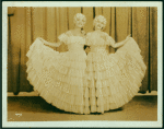 Dancers in long ruffled skirts